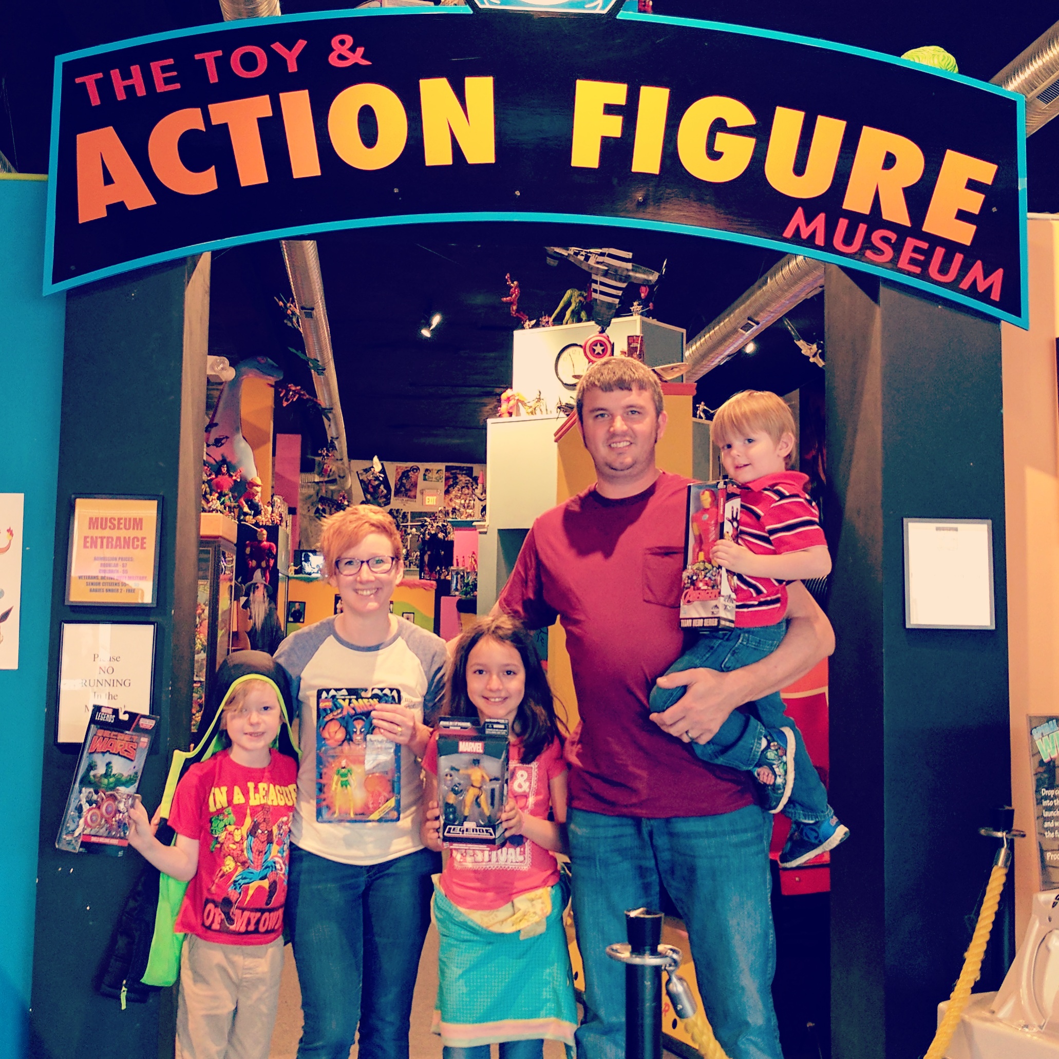 Social Media Consultant and Copywriting Crystal Moreland with her husband and three children at The Toy and Action Figure Museum in Pauls Valley, OK
