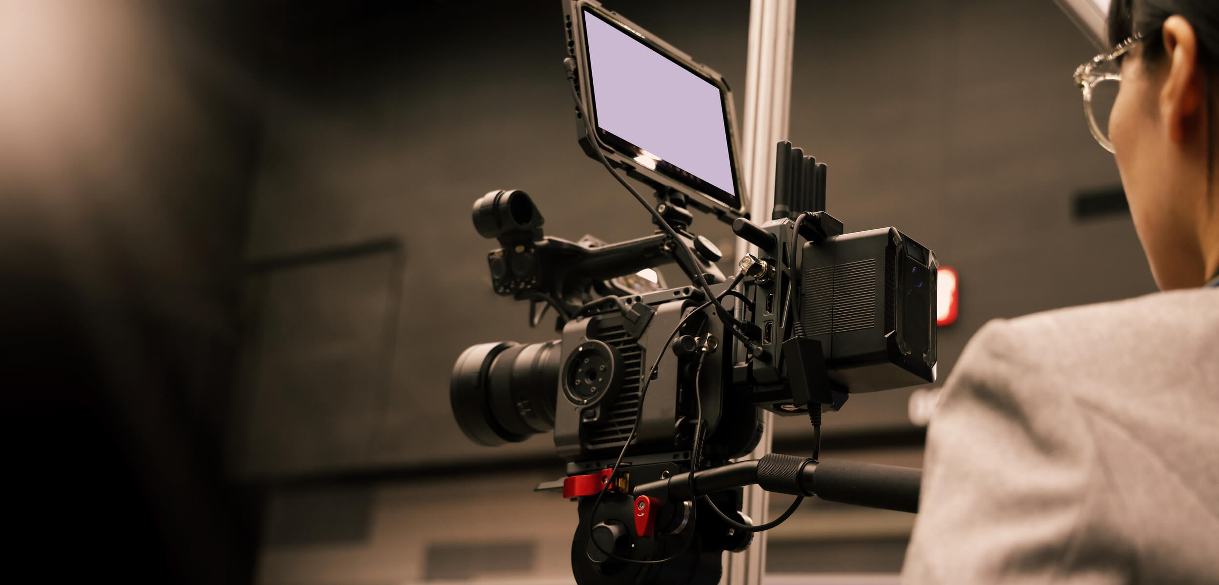 A person using a cinema camera.